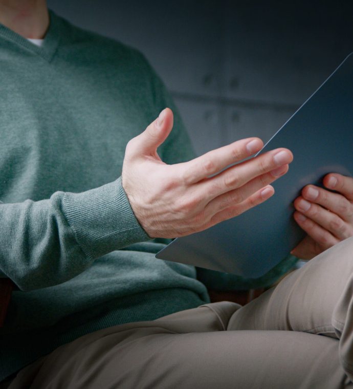 Young professional with clipboard at a psychological session in the office